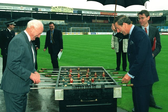 Game was on in this photo as Tom Finney and Prince Charles enjoy a clash over table soccer