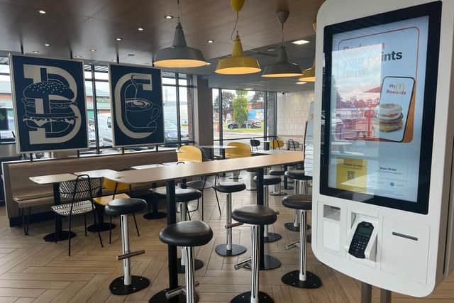 One of the biggest changes has been made to the counter, which no longer fronts the kitchen. Instead, there is now a smaller counter and the kitchen is separate and out of sight. (Photo by McDonald's)