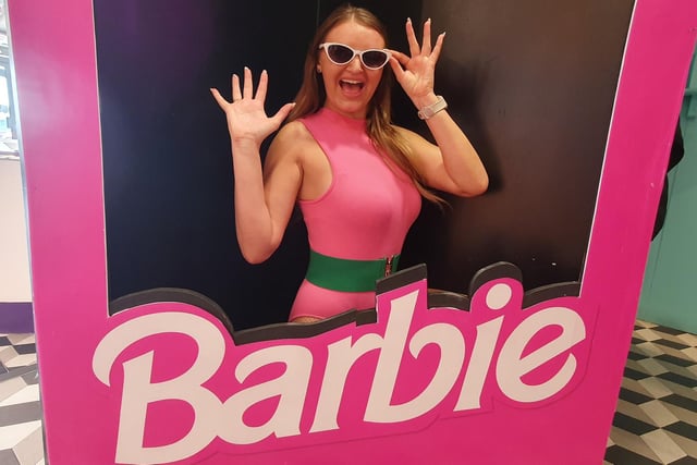 Emma Jayne Sheldon poses in a life-size Barbie box