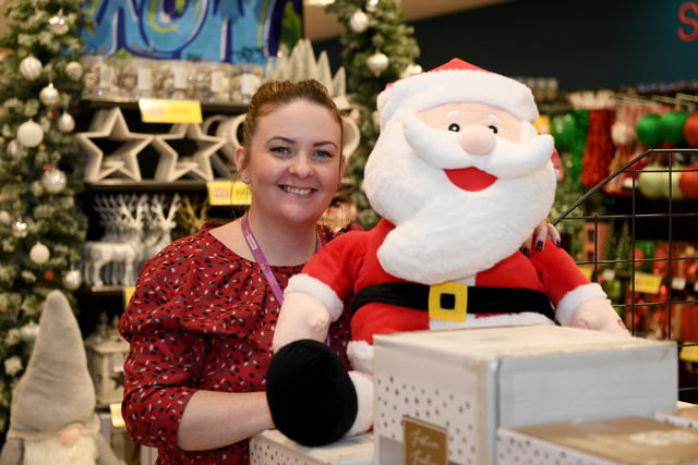 Store manager Sara Bateman is ready for the store's grand opening on Saturday, November 12