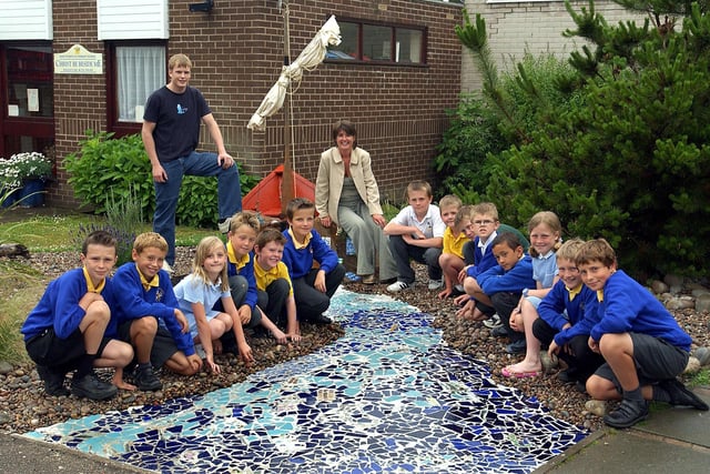 Some of the pupils at St Peters Catholic Primary School, Lytham, who have helped make a "Garden for St Peter" in the school grounds. Also pictured are parent Cath Powell, (who landscaped the garden) and Joseph Thompson (from the artlounge, Lytham) whose mother Nicola worked on the mosaic