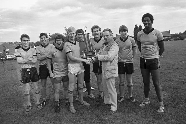 Anyone know who this team of winner is? They were receiving a fine-looking trophy after taking part in a 6-a-side football tournament in Garstang