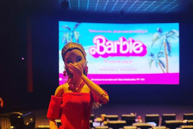 Clare Rawling and her Barbie dolls at the pre-release screen of the Barbie movie.