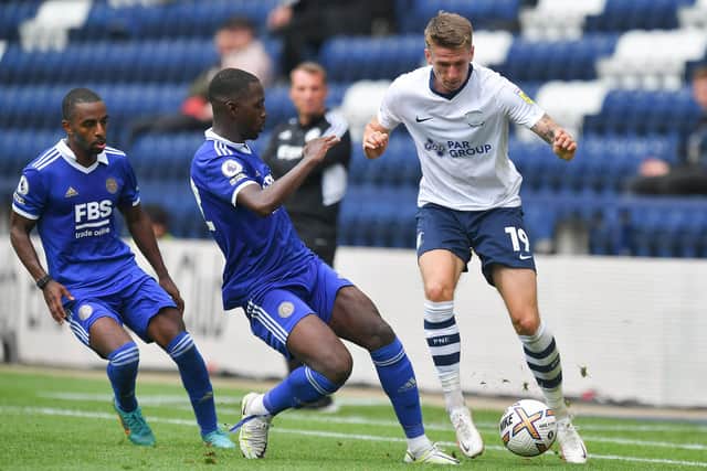 Emil Riis runs with the ball at Deepdale.