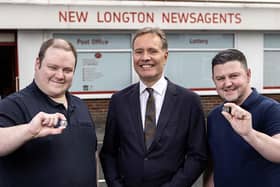 Daniel Cooper of Longton Post Office with The Royal Mint's managing director Andrew Mills and Nathan Jones