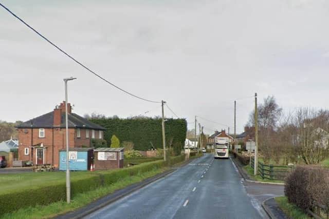 A man died after a car crashed into a fence on The Marshes Lane in Mere Brow (Credit: Google)