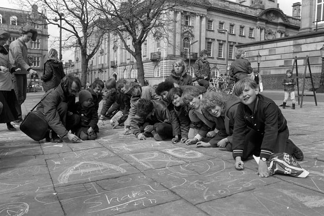 Young pavement artists show off their skills on Preston's Flag Market in 1982