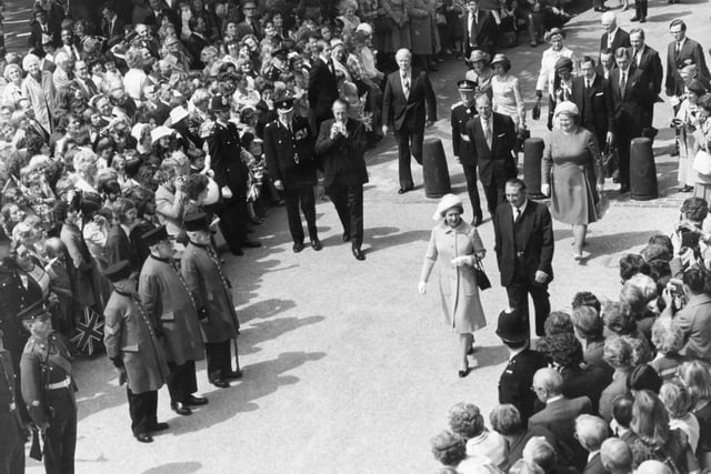 A guard of honour forms as Her Majesty makes her way to unveil the new Obelisk on Preston's Flag Market in 1979