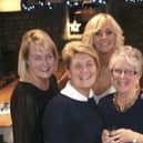 Michelle Williamson (back right) is hosting an afteroon tea event for charity in honour of her lifelong friend Claire Halstead (front left) who died last year aged just 54