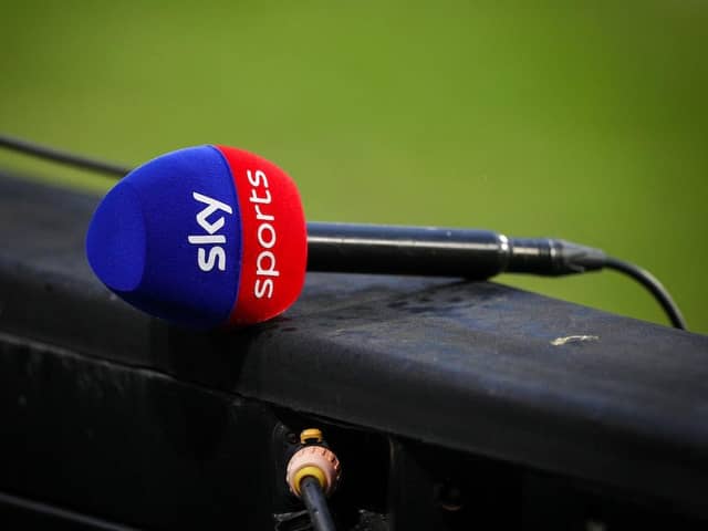 A Sky Sports microphone sits on the advertising boards after the match