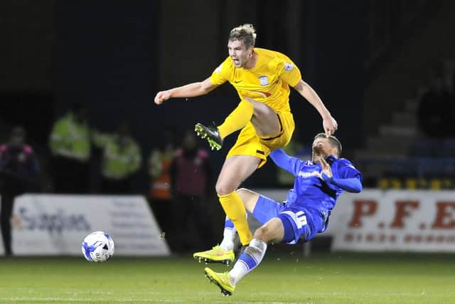 Preston North End defender Paul Huntington is fouled by Gillingham's Cody McDonald