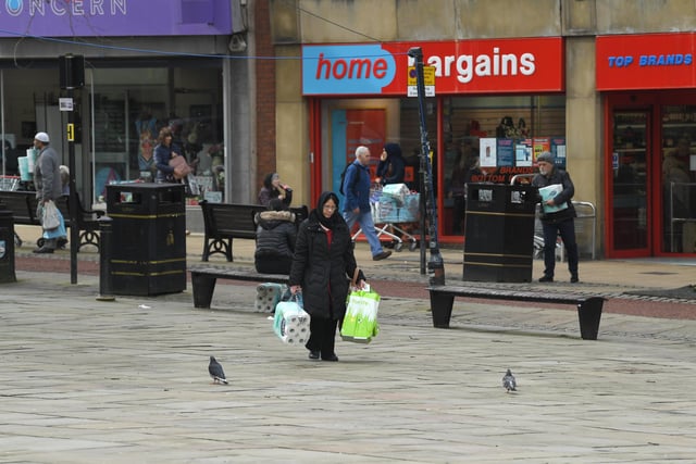 As the pandemic struck, shelves in shops and supermarkets were left bare as people scrambled to get their hands on essentials. Here a few lucky ones managed to buy some toilet roll in Preston city centre