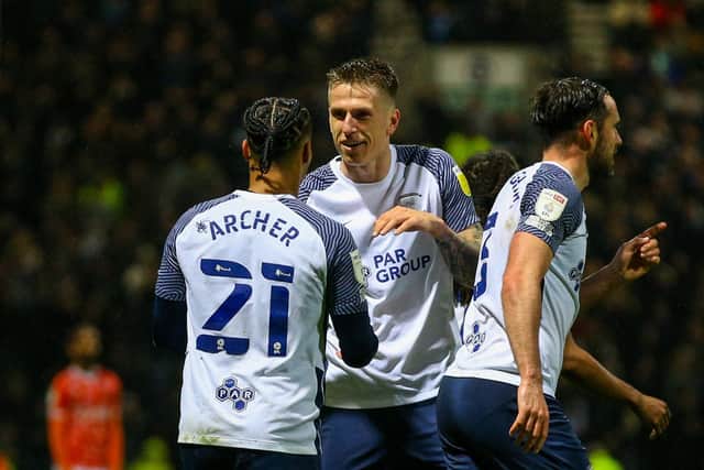 Cameron Archer is congratulated by Preston North End team-mate Emil Riis after scoring against Blackpool