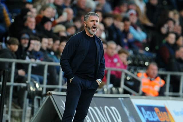 Preston North End manager Ryan Lowe shouts instructions from the technical area