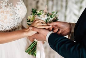 A couple getting married in a traditional church wedding