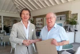 Dario Item, the ambassador extraordinary and plenipotentiary of Antigua and Barbuda to Spain, the Principality of Monaco, and the Principality of Liechtenstein, presenting the award to John Sullivan, of Burnley