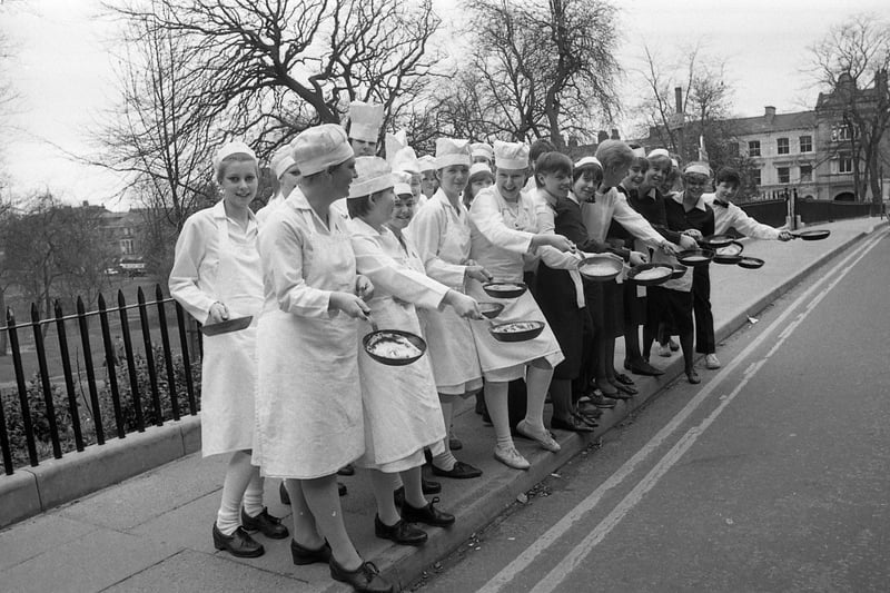 Waiters gave the chefs a real panning in an annual pancake race. Catering students from Preston's Tuson College charged across Winckley Square wielding frying pans and tossing pancakes in the traditional race. Here they are on the starter's blocks... The waiters were eventual clear winners.