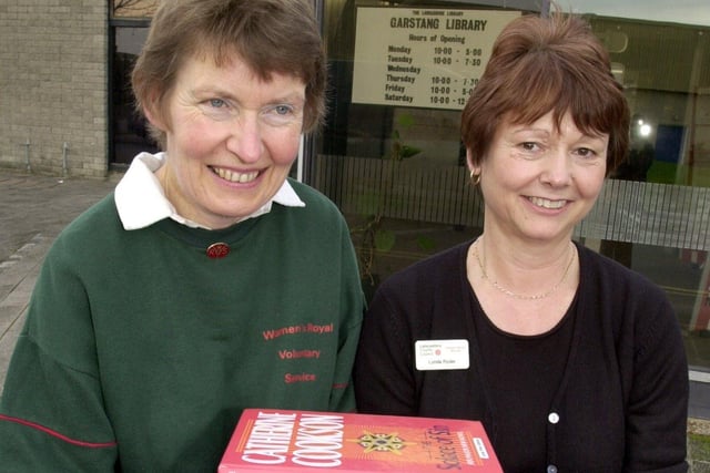 Garstang WRVS 'books on wheels' volunteer, Mary Stribley (left) and Garstang library assistant and 'books on wheels' coordinator Lynda Ryder with some of the books outside the library