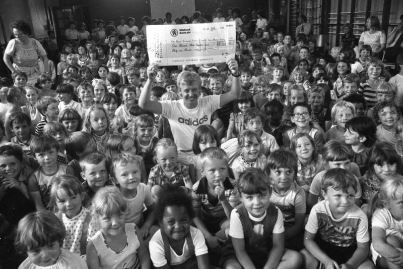 A hush-marathon by a bunch of schoolkids will help to boost the long fight against a killer disease. For around 300 children at Greenlands Primary School, Ribbleton, Preston, raised more than £1,300 for the fight against leukaemia, by holding a sponsored silence. And to put a smile on everyone's face when the cheque was handed over was comedian Les Dennis, who is starring in Blackpool. He is pictured holding the cheque which he received on behalf of the Manchester Children's Hospital Bone Marrow Transplant fund