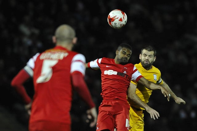 Preston North End's John Welsh battles with Leyton Orient's Bradley Pritchard.