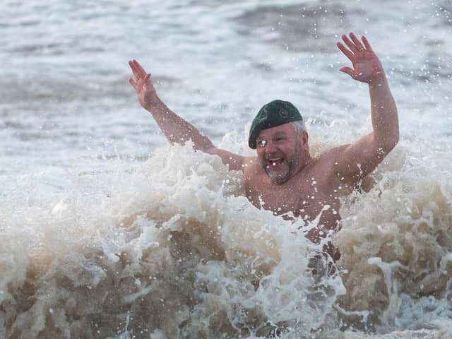 Royal Marines join veteran and 4x cancer survivor Tim Crossin in taking a series of cold water plunge in the sea at Cleveleys. Photo: Kelvin Stuttard
