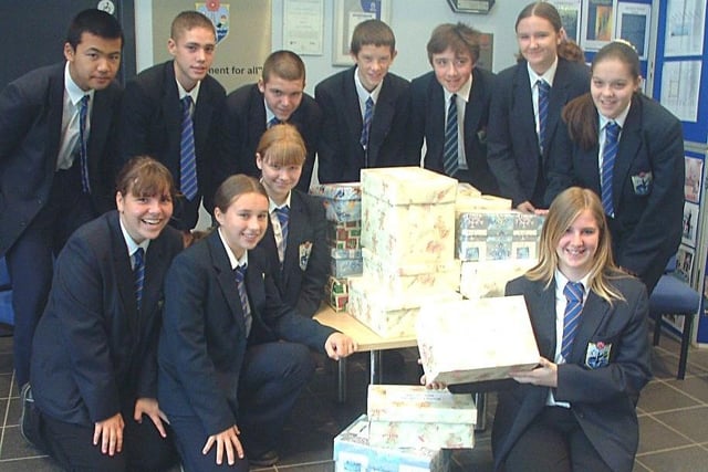 Fleetwood High School year10 pupils with a selection of Christmas parcels for Samaritan's Purse