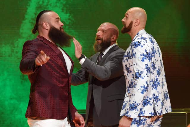 Tyson Fury with Triple H and Braun Strowman during his last WWE appearance