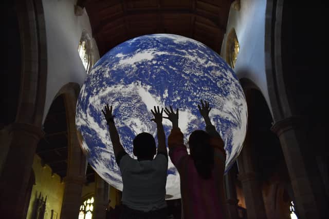 They've got the whole world in their hands, the first visitors to Gaia at Lancaster Priory. Picture by Darren Andrews.