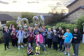 Burnley fan Chris Hogan (front left) with his wife Sam and their family and friends to to celebrate his 1,000th home game