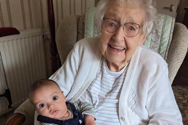 Edna with her newest great-grandson, Wolfie, born 100 years apart.