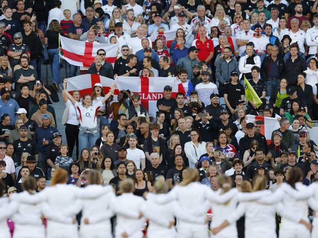 The England team lining up in front of the crowd.