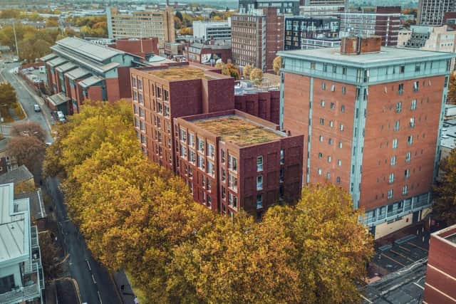The proposed new student accommodation blocks in the foreground, wrapped in an L-shape around the existing Lawson Halls flats (image: Falconer Chester Hall, via Preston City Council planning portal)