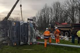 A lorry sheds its load after after overturning on Bluebell Way roundabout in Preston