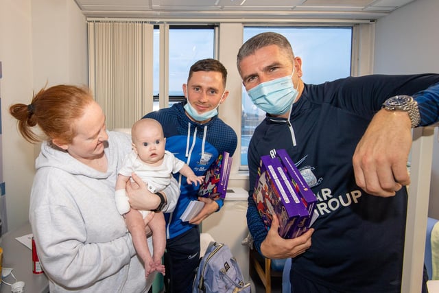 PNE boss Ryan Lowe and player Alan Browne hand out festive treats