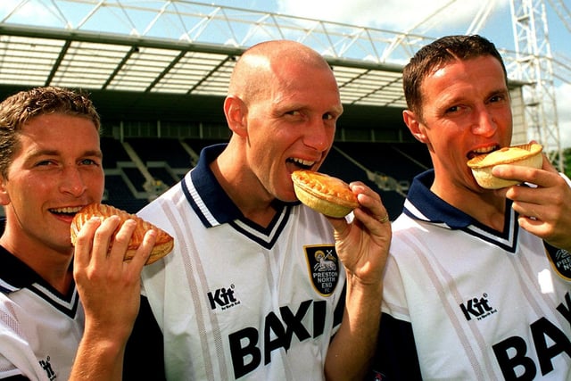 Preston North End stars (left to right) Greame Atkinson, Andy Saville and Ian Bryson munch through some Ashworths pies at Deepdale. All three were popular players with Atkinson starring for PNE on 86 occasions, Bryson was team captain for a time during his 151 appearances, and lastly Saville scored 30 goals in all competitions for the Lilywhites, his 29 League goals making him overall top scorer in the Third Division