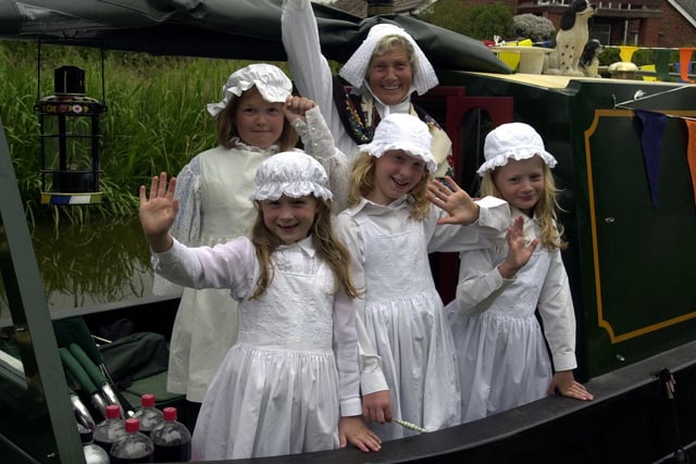 Dressed in traditional canal clothing are, back row from left Carly McKee and Pauline Lang, front Sarah Miller, Heather Lang and Nicola Miller, at the millennium boat rally in Haslam Park, Preston