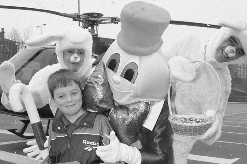 Little Mark Rawcliffe's feet haven't touched the ground since he returned from a dream helicopter flight. His picture of the Easter bunny was picked out from hundreds by jduges at the North Lancashire and Preston Blind Welfare Societys, who organised the special Easter comeptition. Mark, eight, from Kirkham, is pictured with Humpty Dumpty and two Easter bunnies before he was whisked off on his prize trip