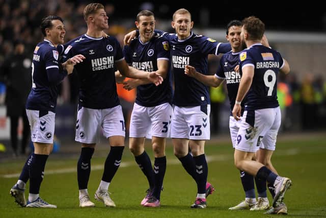 Millwall players celebrate a goal against Swansea City