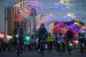 Blackpool's famous Illuminations stretched overhead as these cyclists enjoyed Ride the Lights