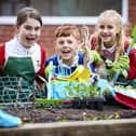 BM - MWmay24-645700 - Pupils at Woodlea Junior School with the donated gardening items from Barratt