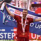 Paul Huntington of Carlisle United celebrates the team's victory and promotion to League One