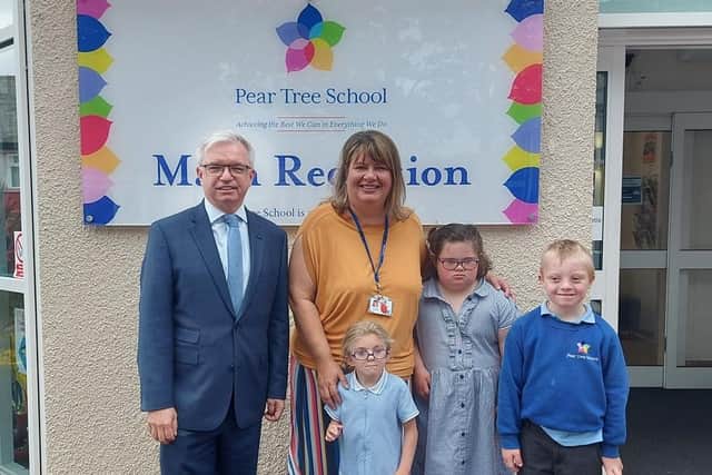 Fylde MP Mark Menzies with headteacher Kate Walker and pupils on his visit to Pear Tree Specialist School, Kirkham