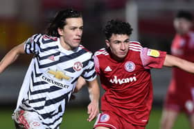 Chorley new boy Rhys Fenlon in action for Accrington against Alvaro Fernandez of Manchester United Under-21s in 2020 (Photo by Nathan Stirk/Getty Images)