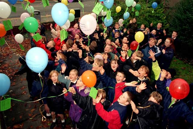 Up, up and away... Children from St Mary's and St Benedict's RC Primary School, Bamber Bridge, celebrate the beginning of National Library Week with a balloon launch at the Bamber Bridge Library, Preston