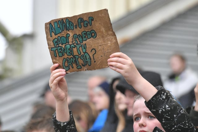 A fan with a sign