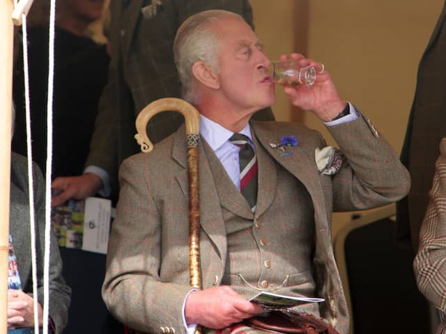 King Charles III enjoys a dram during the Mey Highland Games at the John O'Groats Showground in Caithness. Photo by Robert MacDonald/PA Wire