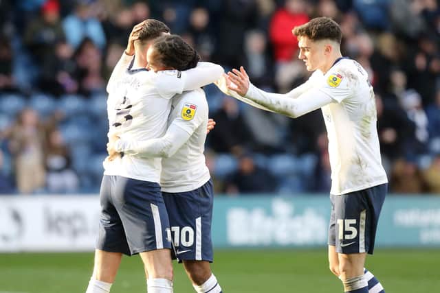 Preston North End's Daniel Johnson celebrates with team-mates Alan Browne (left) and Troy Parrott (right) after scoring the equalising goal from the penalty spot to make the score 1-1