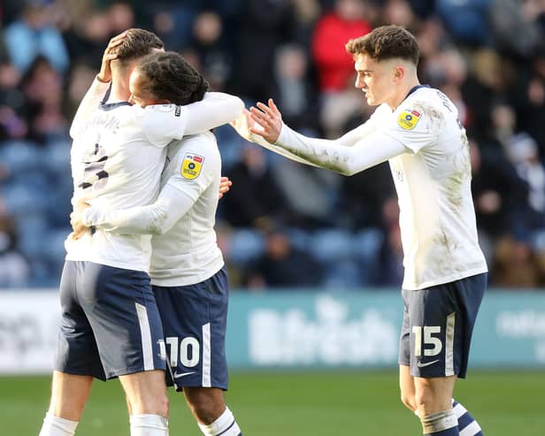 Preston North End's Daniel Johnson celebrates with team-mates Alan Browne (left) and Troy Parrott (right) after scoring the equalising goal from the penalty spot to make the score 1-1