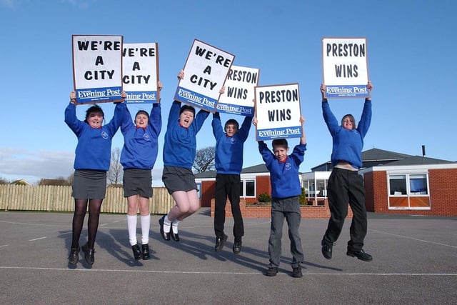 Jumping for joy, choir members from Holy Family Catholic Primary School in Ingol, Preston, from left, Becky Grime, 10, Stephanie Monks, 10, Rosie Hatch, 10, Ashley Woods, 11, David Lloyd, 10 and Ronnie Ritchies, 10, celebrate Preston becoming a city