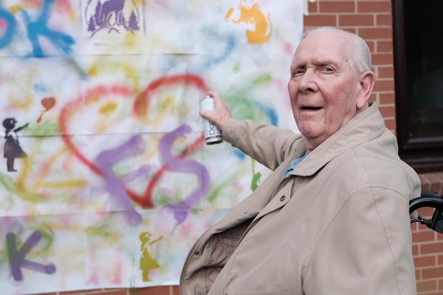 Resident Joseph Russell having a go at graffitiing